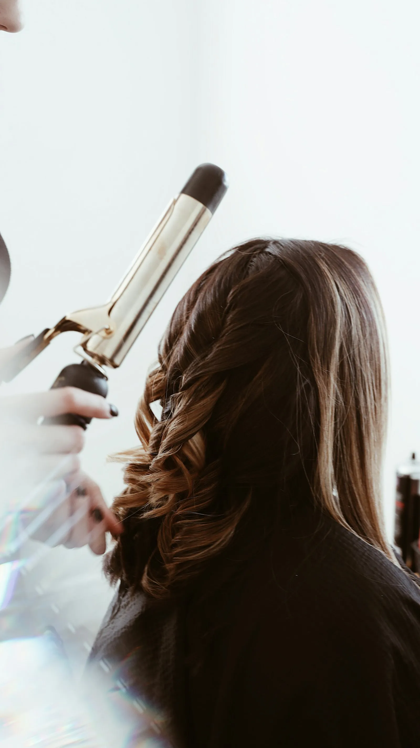 Soft curls being created with a curling iron