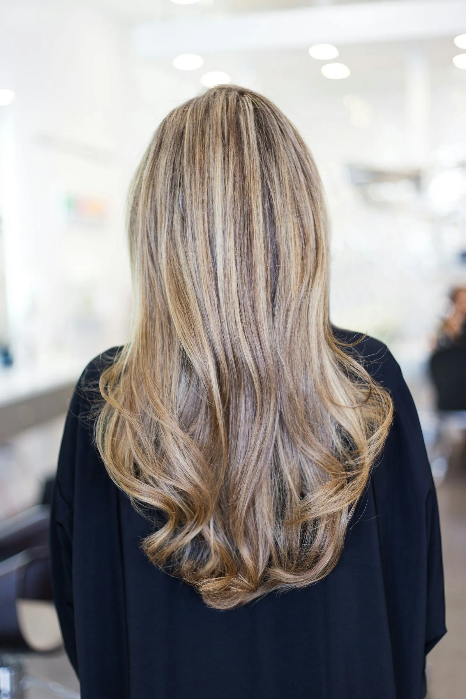 A fresh layered haircut styled at Raquel Hair Salon