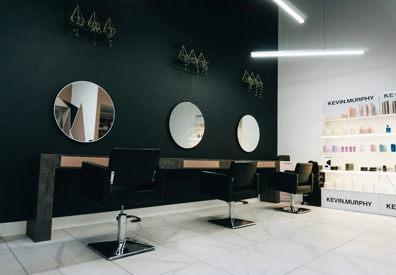 Styling stations and mirrors inside Raquel Hair Salon